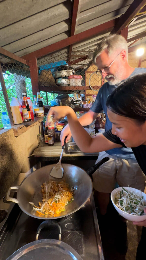 Jim and Pupae making dinner on our overnight stay at Happy Elephant.